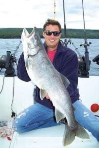 Photo by Darren Peck Tony Frentz of Mankato, MN with the 21-pound, 40-inch lake trout caught while fishing with Captain Darren Peck of Tofte Charters on August 18, 2009. The trout was released.