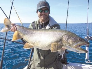 Photo by Captain Darren Peck Blake Yorde of Duluth, MN had awesome luck while fishing with Captain Darren Peck of Tofte Charters recently. The weather was cool, but the fishing was great. Blake is holding his 19-pound, 37-inch lake trout.