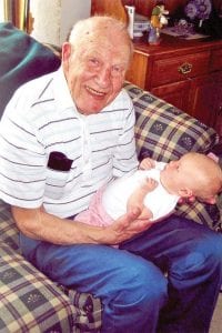 Mert Kvelland, blueberry adventurer, with his grandniece Ruthie Arneson, who was named after his late wife. Kvelland found his way out of a rugged, remote blueberry patch August 15, 2009 despite severe injuries following a fall.