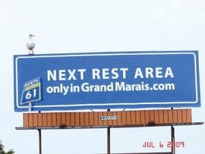 This billboard in Pine County inviting visitors to come rest and relax in Grand Marais no longer has its seagull mascot.