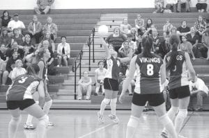 The Vikings volleyball team thrilled the home crowd on Thursday, September 3, defeating the Marshall Hilltoppers in three exciting games. Samantha Jacobsen hammers the return as teammates (L-R) Carly Puch, Brea Boomer, Kristina Rude, and Ashley Deschampe stand ready. Right: Kristina Rude digging while Ashley Deschampe prepares for action.