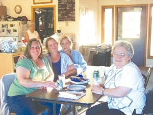 Right: Members of the Lioness Club enjoyed a relaxing evening at Gunflint Hills Golf Course at the Lions steak fry. (L-R) Michelle Korst, Kathy Waver, Karen Waver, Nancy Waver.