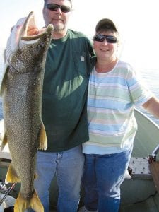 Photo by Dick Nelson Larry and Barb Spaulding of Grand Marais took a short break from the Bed & Breakfast and printing businesses to go fishing with Lutsen's Dick Nelson aboard the 