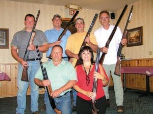 Staff photo/Deidre Kettunen The 17th Annual Ruffed Grouse Society (RGS) Sportsmen's Banquet was held Thursday, September 10 at the Harbor Light Supper Club in Grand Marais. In addition to dinner and updates on RGS activities, there were traditional gun raffles. Winning shot guns at the event were: (L-R, front) Tony Everson, Jean Mathis (accepting for Security State Bank, an RGS sponsor.) (L-R, back) John Skadberg, Bump Blomberg, Gary Radloff Jr., Scott Waterhouse.