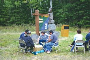 Staff photos/Rhonda Silence The Grand Portage Traditional Drum offers a celebration song at the Grand Portage cairn on September 22. Left: The rock cairns along Highway 61 will serve as markers to connect the communities along the North Shore Scenic Byway.