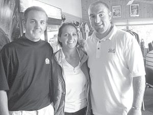 Photos by Irene Malner Over 60 golfers turned out to play 18 holes of golf on September 13 in the first annual Gunflint Hills - Grand Marais Lions Golf Tournament. Carline Gresczyk and her sons, Todd Gervais and Greg Gresczyk, celebrate their win. Carline and her sons came in three under par.