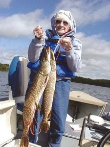 Photo by Joe Carlson Marian Kimball of Grand Marais had a great day fishing with Joe Carlson of Joe’s Inland Fishing Service. Her first catch was a two-forone— a 31-inch northern grabbed her 13-inch walleye and wouldn’t let go! She also caught a 27-inch northern on a minnow in 14 feet of water. Good job, Marian!