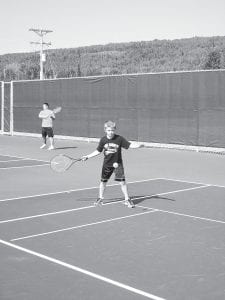 Leif Anderson was one of several Cook County Tennis Association youth who demonstrated their skills for those attending the grand opening of the new tennis courts.