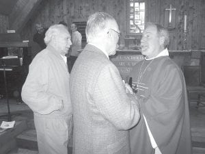 Photos courtesy of Trinity Lutheran Top: The anniversary celebration brought many folks to the lovely Hovland church. (L-R) Carl Eidness, whose father was the first Trinity pastor; Pastor Bob Stoskopf of Bethlehem Lutheran Church; and Bishop Tom Aitken shared reminiscences about the church and community. Bottom: Bonnie and Paul Muus visited with Esther Erickson after the hymn sing.