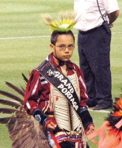 Photos courtesy of Grand Portage community Grand Portage youths participated in the Ninth Annual American Indian Heritage Day with the Minnesota Twins at the Metrodome on Saturday, September 19, 2009. Upper Left: Senior Brave Jaden Aubid represented Grand Portage. Upper right: Grand Portage Senior Princess Autumn Clearwater-Day dancing on the field with the other Princessess— she is the sixth dancer, above the “n” in the Minnesota Twins emblem. Far Left: Conrad Roy showing his Twins baseball souvenir. Conrad tossed out the ceremonial first pitch, in memory of his grandfather, Grand Portage tribal elder, Gilbert Caribou. Left: Autumn Clearwater-Day waits to dance.