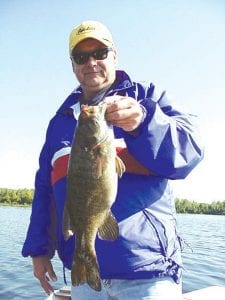 Photo by Joe Carlson Jeff Vanthournout of Chanhassen caught this 18’’ smallmouth on a jig and a minnow while fishing with Joe Carlson of Joe’s Inland Fishing Service. He said they also caught “lots of small walleyes, better than nothing!”