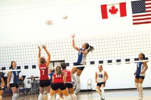 Photos by Bruce Johnson ~ www.BruceJohnsonPhoto.com Left: Brea Boomer spiking the ball at the Homecoming battle against the Cromwell Cardinals. Libero Chelsey Sorenson is ready for the Cromwell return. Top: Christina Nelson hammers the ball over the net to the Cromwell players, while Essa Jacobsen prepares to assist. The Vikings defeated Cromwell, bringing their season record to 8-2 in the conference and 11-4 overall.