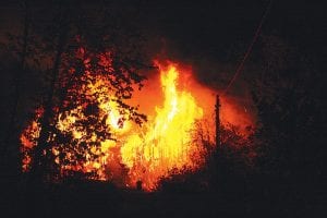 Photo by Carl Foster The home of Tom VanCleve and Bruce Stahly burned to the ground the night of Saturday, October 19, 2009. Flames could be seen from County Road 7 just outside the Grand Marais city limits.