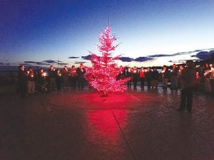 Photo courtesy of Violence Prevention Center A Candlelight Vigil of Hope was held on Thursday, October 8 at Harbor Park in downtown Grand Marais. Community members gathered around a beautiful pine decorated with purple lights—representing those who have been lost to domestic violence. Attendees sadly remembered the 20 people who have lost their lives this year alone—eight of the victims were children, one a police officer responding to a domestic violence call. The Candlelight Vigil is sponsored by the Violence Prevention Center in recognition of Domestic Violence Awareness Month in October. If you or someone you know need help, contact the Violence Prevention Center at (218) 387-1262.