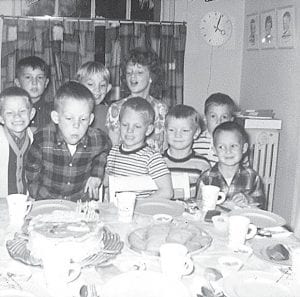 Photo courtesy of Dale Saethre Who are these kids, eager for cake? They are (L-R, front) Tod Sylvester, Mike Saethre (the birthday boy, turning eight!), Dan Saethre, Rory Lindskog, David Saethre. (L-R, back) Jerry Waha, Jeff Sylvester, Susie Saethre, Wiley Thompson. The date on the picture is November ’65.