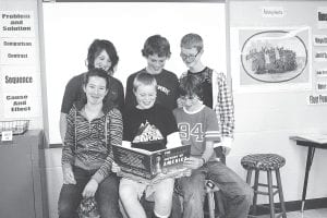 The Cook County junior high Knowledge Bowl team does a little bit of research in preparation for its October 19 competition. (L-R, front) Audrey Summers, Lars Scannell, Joey Chmelik. (L-R, back) Megan Lehto, Daniel Ahrendt, and Zack Sturm.