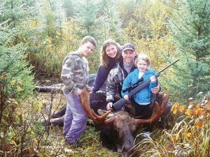 Photo courtesy of the family After 11 years of applying for a once-in-a-lifetime Minnesota moose license, Darren Peck of Tofte was lucky enough to get a permit this year. He shot the moose on October 7. Its antlers are 45 inches wide. The Peck family is pictured with the bull moose—Darren, Anna, Jack and Katie.