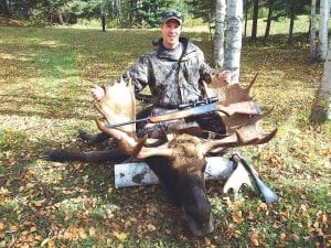 Photo by Michael Ficken, Sr. This massive moose with a 49-inch antler spread was taken by Michael Ficken Jr. from Savage, MN, on Wednesday evening, October 7, with a .300 Winchester Magnum. Ficken was hunting by Pendant Lake, near Devil Track Lake in Grand Marais. He called the moose in and shot him at a distance of 20 yards.