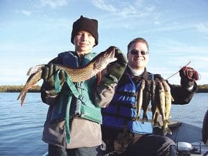 Photo by Joe Carlson Evan and Matt Jones, of Maple Grove, of Maple Grove had a great day of fishing despite the cold weather. They were lucky to have a little sun—the next day, October 10, brought Cook County’s first snowfall! Evan is pictured with his first northern, a nice one at 26.5-inches. They caught other fish, including a 17-inch walleye using a jig and minnow in 12 to 17 feet of water.