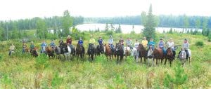 Above: Sixteen horses and riders took part in the Wilderness Challenge 2009. Right: Nancy Gustafson leads a group of Wilderness Challenge participants out on the trail.