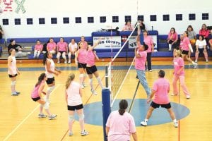 Photo by Bruce Johnson ~www.BruceJohnsonPhoto.com The Cook County Viking varsity volleyball team hosted a very successful—and fun—fundraiser for breast cancer research on Tuesday, October 20. The varsity girls played four games, against teachers and staff at Cook County High School, against their parents (pictured above), and against two different alumni teams.