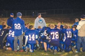 Photo by Todd Smith Above: Cook County Football coaches were all smiles in the huddle at the Wednesday, October 14 game at Lyle Anderson Field. The Vikings put together their best game of the year and defeated the Carlton Bulldogs, 27-10.