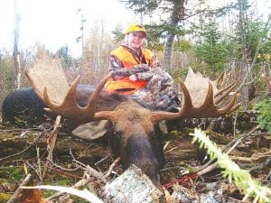 Photo courtesy of Gunflint Pines Kelly Holmin, 12, of Nicollet, MN, with the moose she shot in the Greenwood Lake area. The moose had a 58-inch antler spread. Her father is a taxidermist and the family plans to do a whole mount of the moose head.