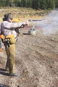 Photos by Gary Siesennop The Cook County Sportsmen’s Club met at a gravel pit on County Road 6 in Grand Marais for some socializing and shooting on Saturday, October 17. Above left: Sportsmen’s Club member Neil Hansen makes some smoke with a black-powder revolver.