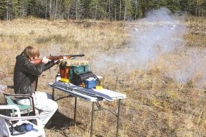 Above right: Will Hellner tries his hand with a black-powder percussion rifle.