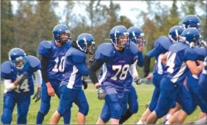 Above: The Vikings head to the defensive line at Ely. Cook County Vikings defeated the Ely Timberwolves, 34-6 on October 22.