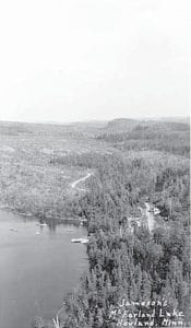 Photo courtesy of Minnesota Historical Society The view from Woolly’s Bluff, looking at Jameson’s on McFarland Lake in the Hovland area. The picture is from the Minnesota Historical Society postcard collection, circa 1935.