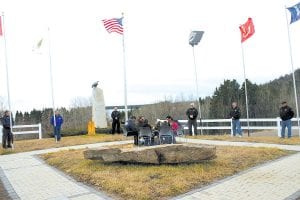 The Grand Portage community gathered for a traditional Veterans Day ceremony on Wednesday, November 11, 2009 at the Grand Portage Veterans Memorial. The Stonebridge Singers, a young drum group mentored by members of the Grand Portage Traditional Drum, performed an honor song as veterans raised flags representing the branches of the military.