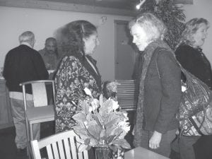 Judie Johnson (left) talking to Rebecca Wiinanen at East Bay Friday, October 23, 2009 after sharing some stories of her life adventures. The brown bag lunch engagement was part of an ongoing series sponsored by the Violence Prevention Center. Johnson, wearing a sweater she knit, said even knitting can be an adventure.