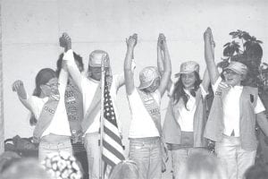 Right: This sixth-grade group of Girl Scouts bridged from being Juniors to being Cadettes. From left: Kim Dossey, Isabel Wahlers, Natassja Sheils, Bethany Derscheid, and MaeAnna LaFavor. Behind them is older Cadette Michaela Peterson.