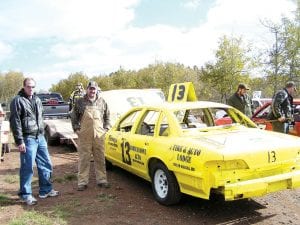 Local racers competed in the Enduro races at Proctor Speedway in October. J.J. Liljestrand of Grand Marais in the pit next to his bright yellow #13 car.