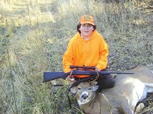 Dylan Deschampe, 12, of Cook County shows the eight-point buck he shot at 11:00 a.m. on Opening Day, November 7. It was Dylan’s first year of hunting. He was out with his dad, Ernie Deschampe, when he got the deer in Grand Portage.