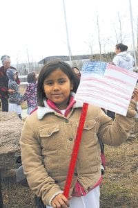 Among the students from Oshki Ogimaag attending the Grand Portage Veterans Day ceremony on November 11, 2009 was Shylan Vondall who brought her own lovely handmade American flag.