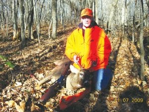 Julie Nelson of Grand Marais with her first-ever deer, shot just 45 minutes into the season. The six-point, 175- pound buck was shot a few miles out of Grand Marais on the Gunflint Trail.