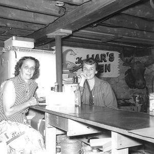 Billie Peterson with a resort guest in the Tait Lake Lodge 