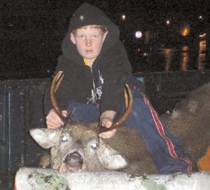 Colton Thompson, son of Rebecca Thompson and Jeff Eliasen of Grand Marais, with his 180-pound buck. The buck had an antler spread of 13 ¼ inches.