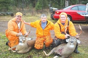 Although he hasn’t gotten a deer yet, Brian Silence of Grand Marais (center) had a great time hunting with friends, Jeff Becker of Mankato (left) with his eight-point buck, taken in the Hovland area and Justin Miller of Mankato with his nine-point buck, shot in the Devil Track area.