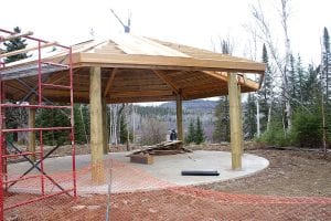 The quiet of Grand Portage State Park has been disturbed in recent months as construction of a new 5,800 square foot visitor center has been underway. The visitor center and other features are starting to take shape and visitors now see a glimpse of how welcoming the park will be when work is completed. Above: In addition to the large visitor center with interpretive displays, there is a large open pavilion, perfect for family or ceremonial gatherings. Lower right: A new observation deck overlooking the water is another new addition. Above right: While construction is underway, the park is closed during the week because of limited parking and safety concerns. However, visitors are welcome on the weekend, as this temporary sign demonstrates. Park manager Rick Novitsky said the park hopes to be in the new building by Memorial Day 2010.