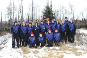 Above: The Viking Nordic ski team is off to a great start—all they need now is snow! (L-R, front) Pete Summers, Ben Resek, Will Seaton, Joe Rauzi. (L-R, middle) Nate Carlson, Cheyenne Sorlie, Nuchada Srisittipoj, Joey Chmelik, Lino Rauzi, Audrey Summers, Mara MacDonell, Ben Seaton, Katrina Axtell, Kieran Scannell. (L-R, back row) Dick Swanson, Karlee Axtell, Shelby Ahrendt, Alex Ditmanson, Sarah O’Phelan, Daniel Ditmanson, Jordon Zunker, Mark Summers, Kelly Summers, Hank Bemlott. (Not Pictured: Roman Schnobrich, Natalie Nalezny, Saffron Straub). Left: With no snow, some of the Nordic skiers decided to try “skating” on some ice at Pincushion! From front to back: Nuchada Srisittipoj, Shelby Ahrendt, Mara MacDonell, and Katrina Axtell.