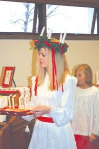 The 35th Julefest celebration was held at Bethlehem Lutheran Church in Grand Marais on Saturday, December 12, 2009. Entering the fellowship hall as St. Lucia for this traditional Scandinavian event is Jessica Berg-Collman, followed by Taryn Hansen. For more Julefest memories, turn to page A3.