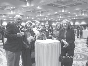 Above: A contingent of county residents attended the Ordination of Bishop Sirba at the DECC Auditorium. They gathered in the Lake Superior Ballroom for the reception after the ceremony. (L-R) John Franz, Clara LeSage Koslowski, Joy Carlson, Kathy LaVigne, Shirley Trovall, and Mary Petz. Left: Marie Spry of Grand Portage was among members of the Indian community within the Diocese who presented the gifts of bread and wine. Spry chose to wear a very special necklace and earrings, designed by the late Sharon Vogel.