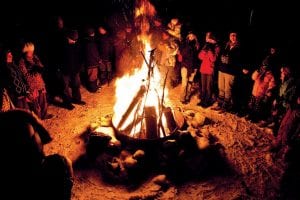 Photo by Stephan Hoglund ~www.stephanhoglundphotography.com A roaring bonfire and a festive potluck—what better way to chase away the winter blues? The Winter Solstice at North House Folk School on Monday, December 21 offered that, along with a delightful shadow puppet program. See more of the Solstice celebration on page A13.