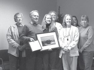 Photo by Kay Rosenthal Dr. David Blomberg, who has been the supervising pathologist for the Cook County laboratory since 1991, is retiring at the end of December. Dr. Blomberg will retain honorary medical staff status. Laboratory staff held a small retirement celebration. (L-R) Kathy Siesennop, Dr. David Blomberg, Jennifer Backstrom, Denise Murray, Nadine Brown, Bryann Bockovich, Gine Meissner.