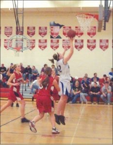 The Vikings defeated the Cromwell Cardinals, 59-44, on Friday, December 18. Left: Essa Jacobsen lays in a shot. Above: Brea Boomer shoots for two.