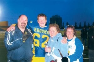 Photo courtesy of the family Gayle Lyght of Lutsen traveled to Edmonton, Alberta last month to watch her grandson’s team play in—and win—the high school championship game. Shown following the game are, from left, Stewart Luchies and his son Chris, Lyght, and Chris’s mother Donna Luchies.