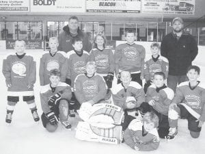 Photo by Susan Roy The Cook County Mite 2 team traveled to Cloquet for an exciting tournament on Dec. 19-20. Front: Goalie Cameron Roy (L-R, kneeling) Josh Prom, Ethan Sporn, Tristen Bockovich, Chase Gwash, Will Ramberg. (L-R, standing) Andrew Miller, Connor Somnis, Trevor Berglund, Alyssa Lashinski, Jayden Grivette, Levi Sheils. Coaches Steve DuChien and Paul Sporn.